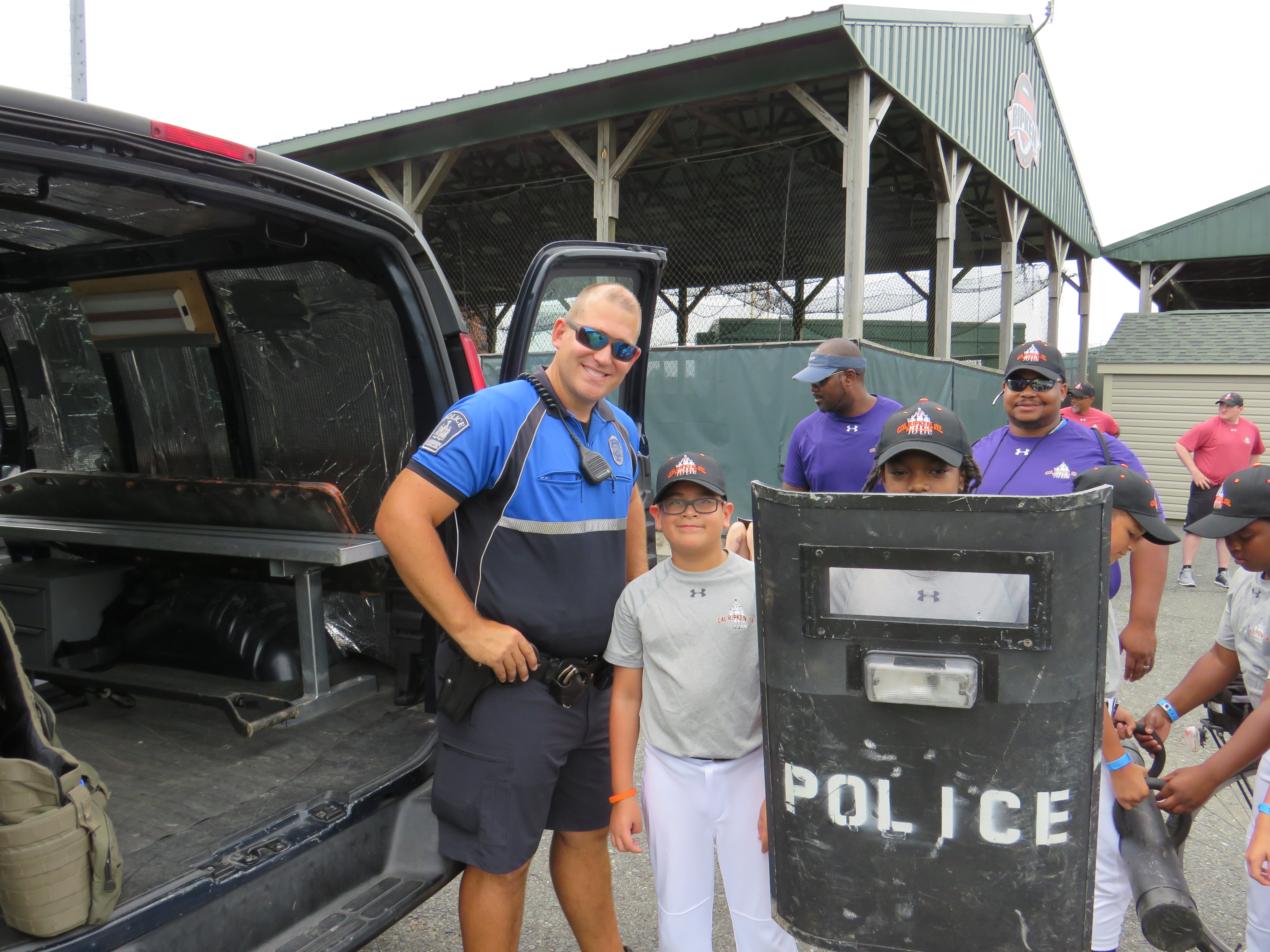 kids with cop shield