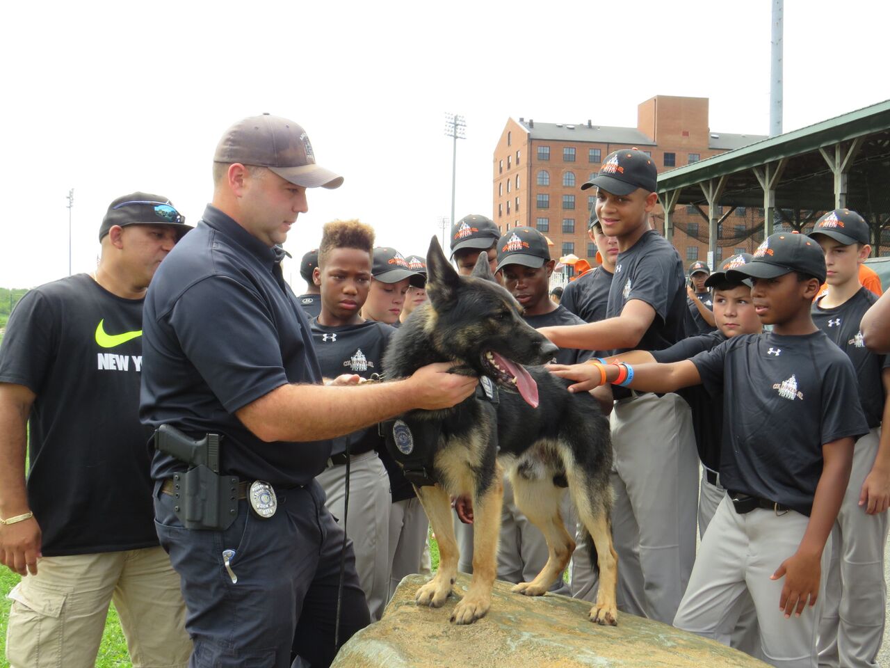 A police officer and his canine partner meeting CRSF camp youth