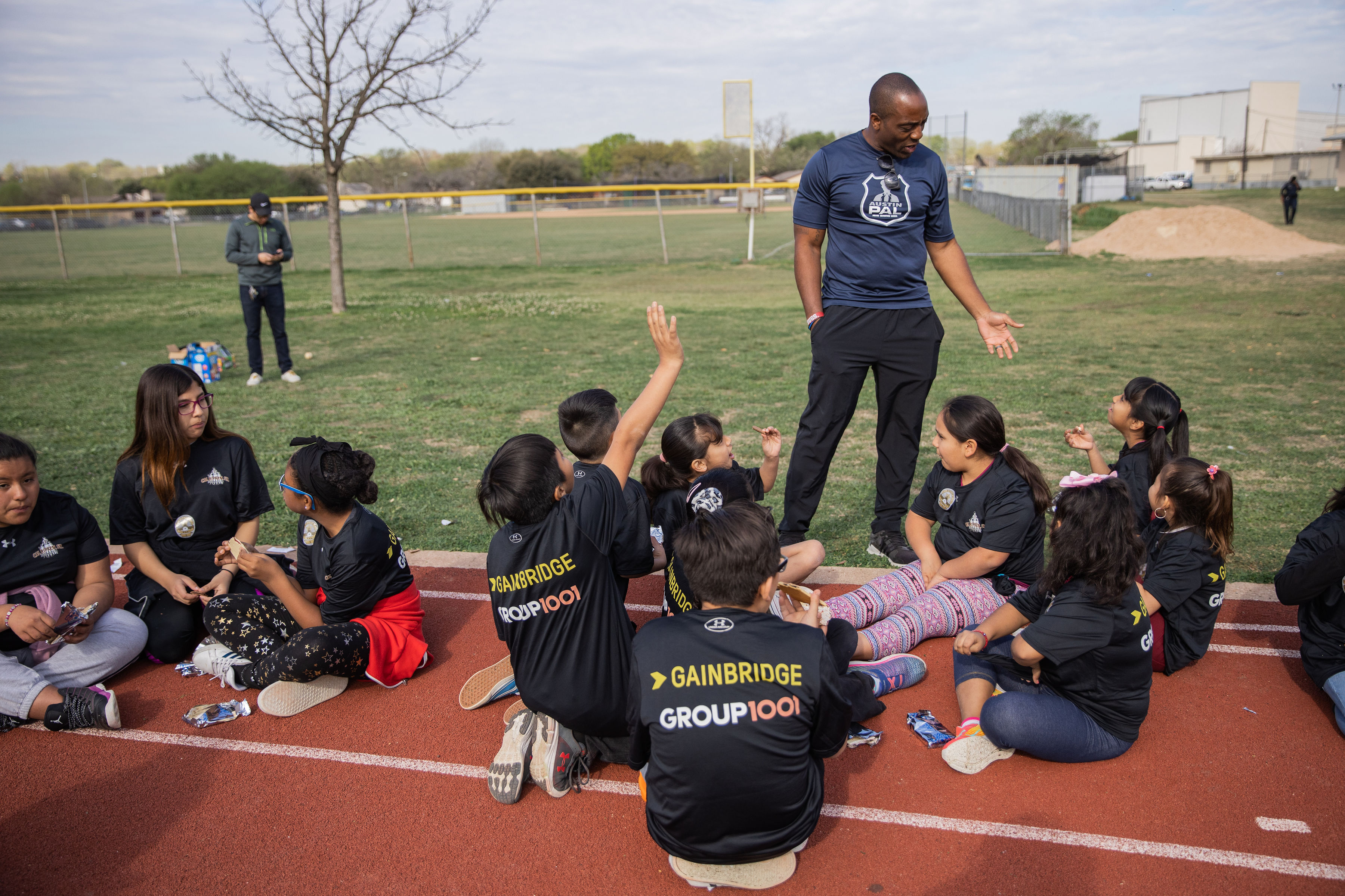 Austin Police Department Officer Jeremy Bohannon with youth at a clinic