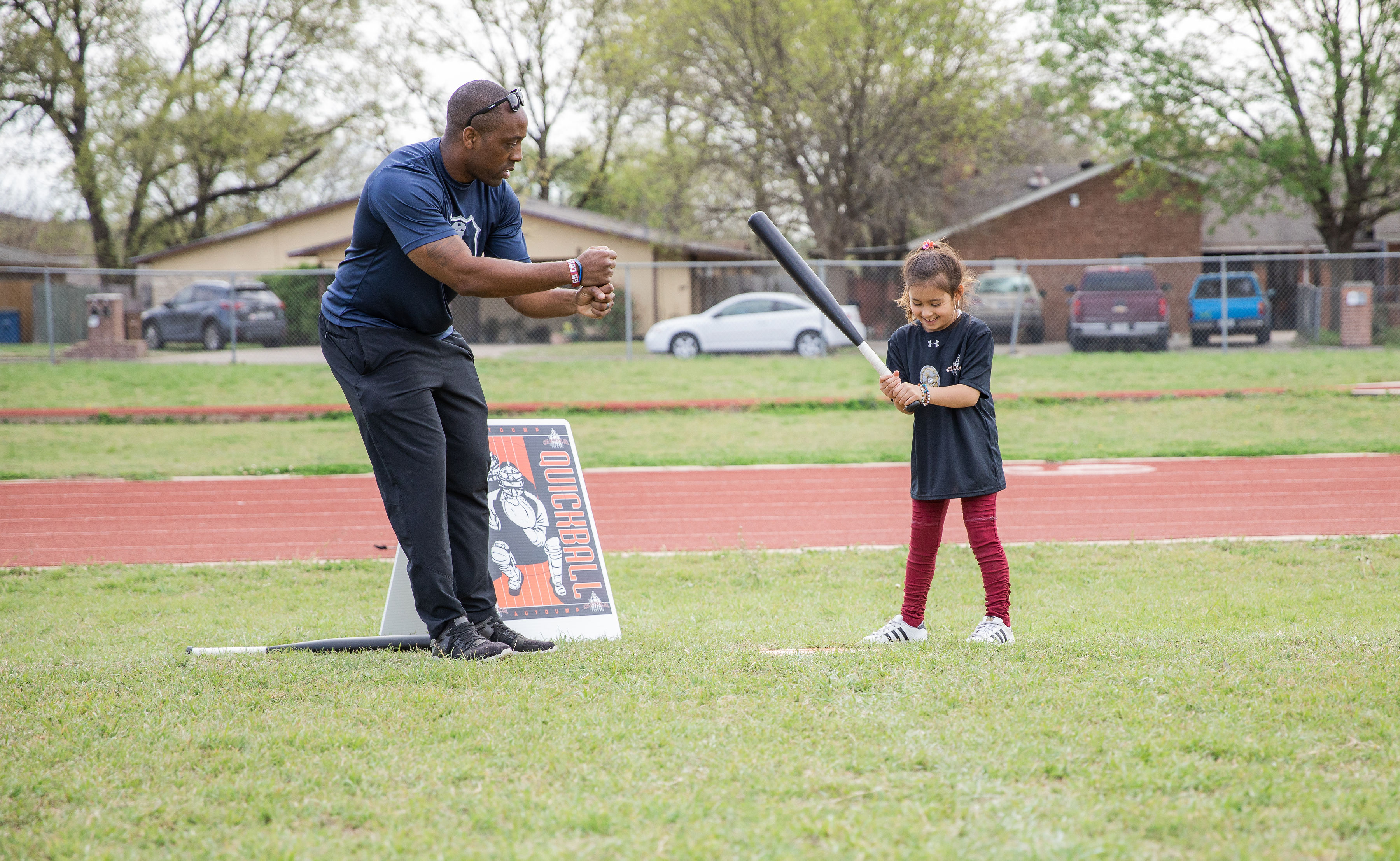 Austin Police Department Officer Jeremy Bohannon with a youth at a clinic
