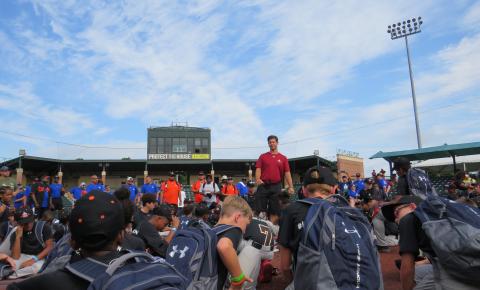 Campers hearing from coach Scott on the field