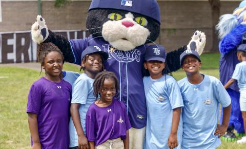 Tampa Badges youth posing with mascot
